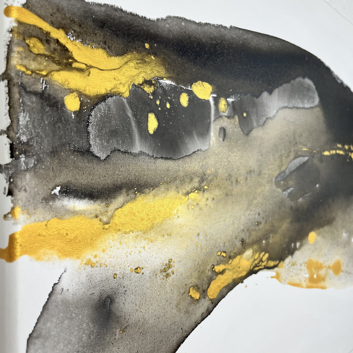 Abstract painting in black, gray, and gold tones by Charlotte George, Earth’s Whisper IV, expressing the molten energy and stillness of the earth.