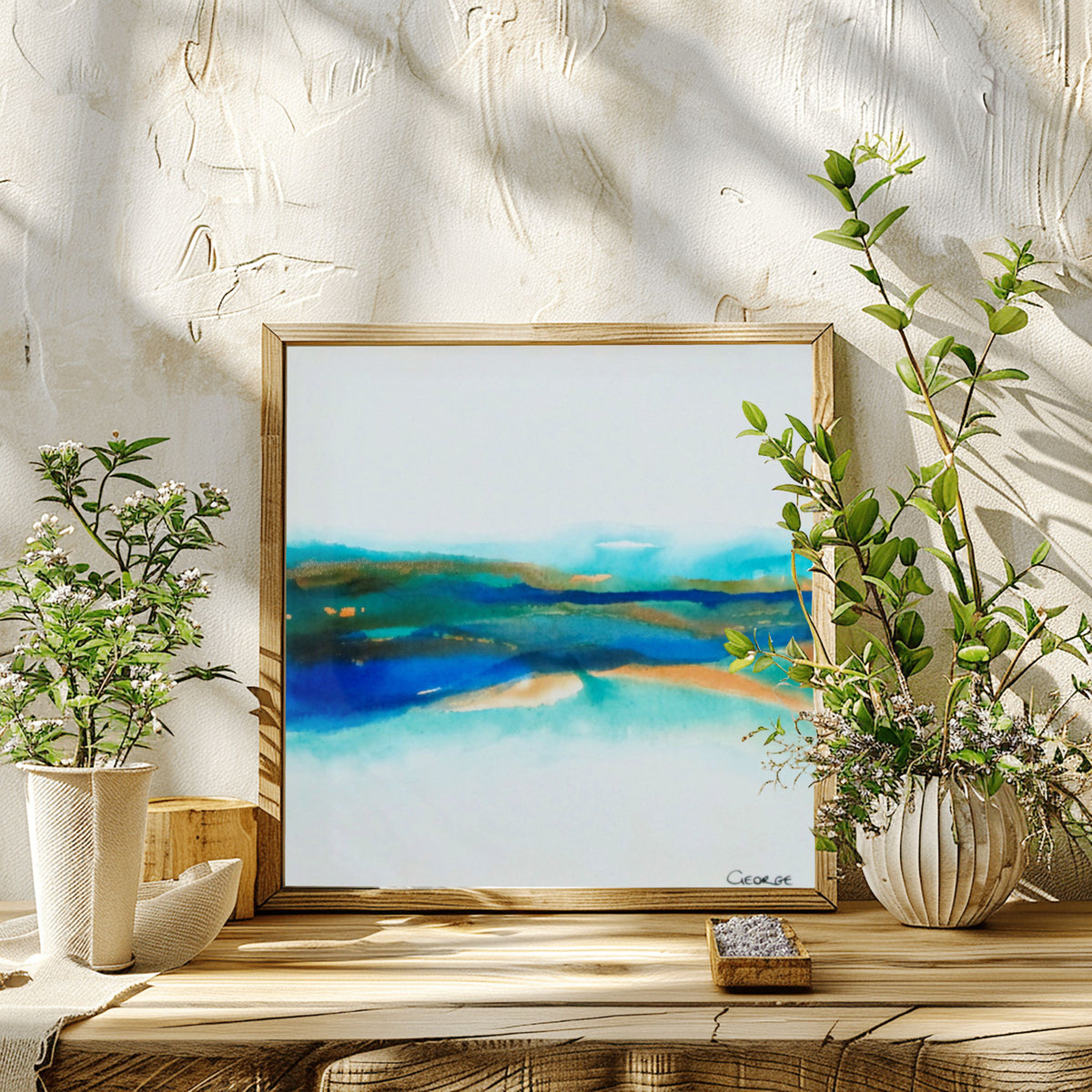 Abstract painting by Charlotte George Artist with soft layers of turquoise, brown, and blue ink flowing across a light canvas